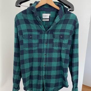Two mens flannel shirts
